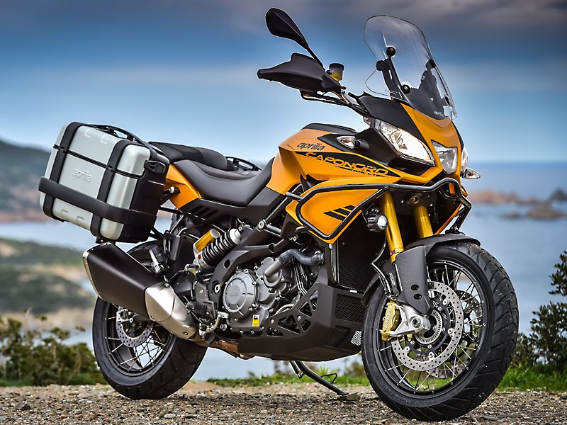The Caponord Rally ups the adventure quotient with 19-inch front wheel, skid plate, brush guard, larger, more effective windscreen, LED spotlights, handguards and 33-liter saddlebags.